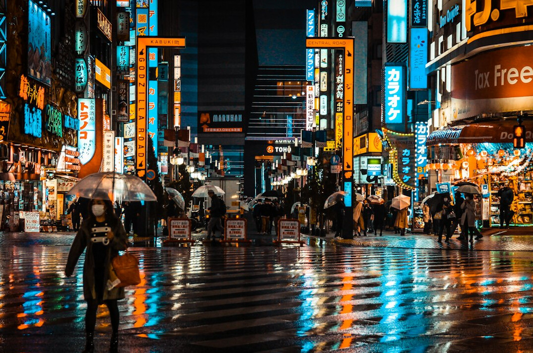 people walking on busy city street