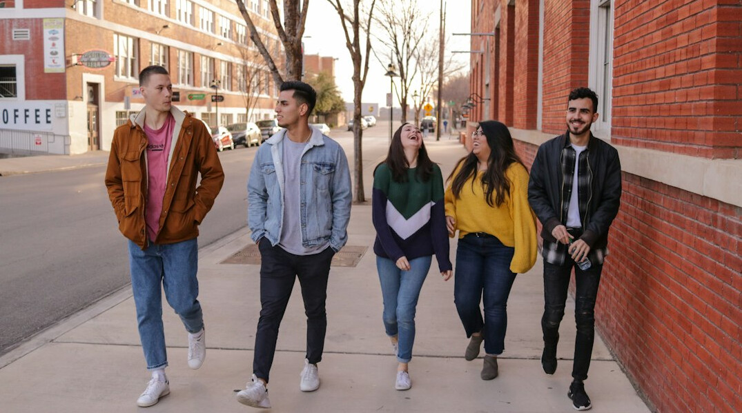 group of friends talking on street