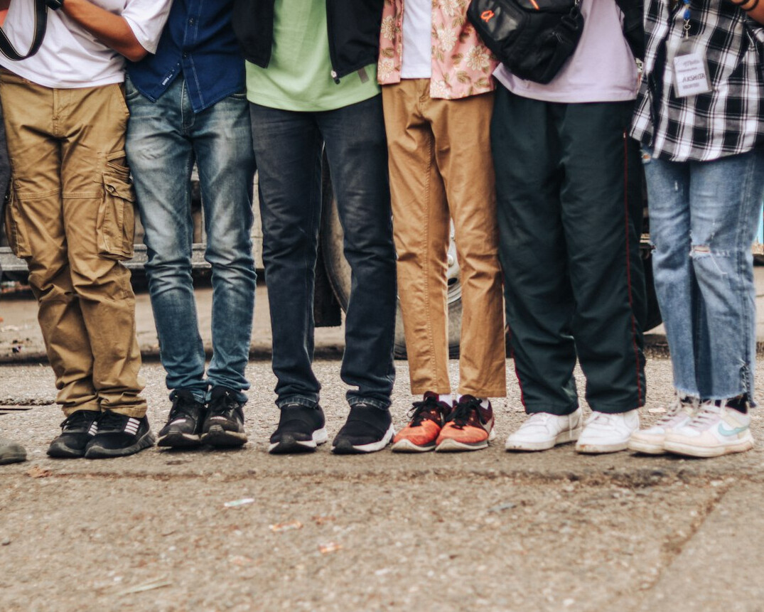 diverse people standing in line