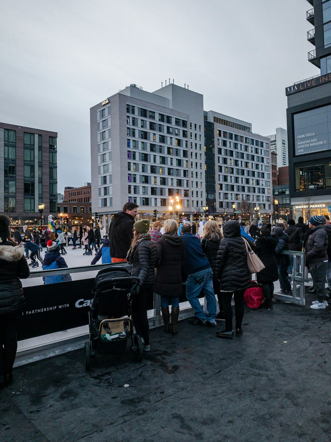 crowd forming line in downtown
